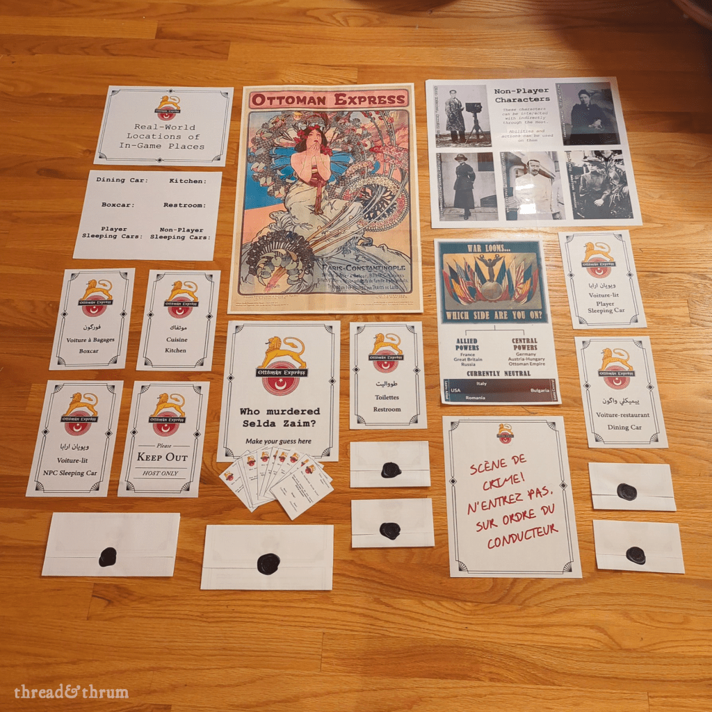 An array of signs, posters, and sealed letters laid out on a wood floor, including a tweaked Alphonse Mucha poster that reads "Ottoman Express," a poster laying out the two major factions at the start of World War I, the Non-Player Character poster, and various signs to designate different rooms of the game, such as the Dining Car